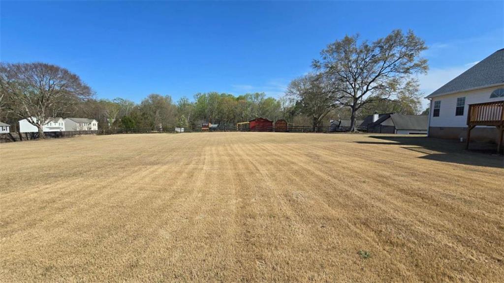 352 Olde Wick Trail Hoschton, GA 30548 - Photo 30 of 34 a view of an outdoor space and a yard