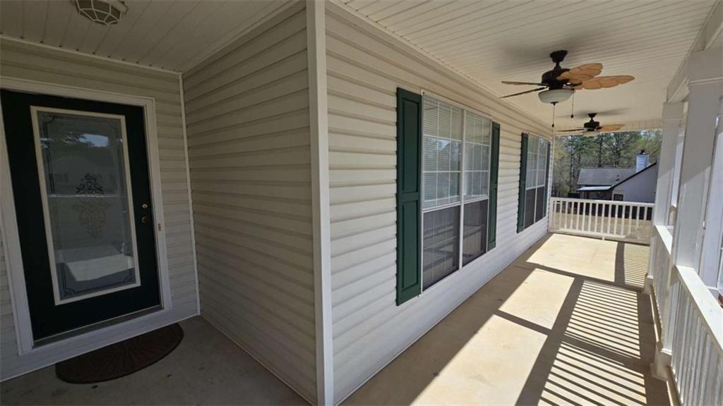 352 Olde Wick Trail Hoschton, GA 30548 - Photo 3 of 34 a view of balcony with wooden floor