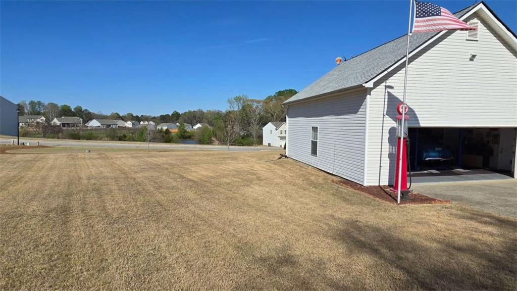 352 Olde Wick Trail Hoschton, GA 30548 - Photo 34 of 34 a view of a house with a yard and mountain view