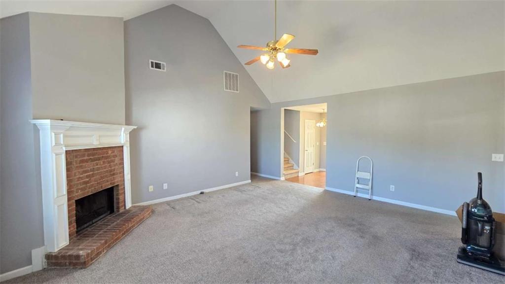 352 Olde Wick Trail Hoschton, GA 30548 - Photo 7 of 34 a view of empty room with a fireplace