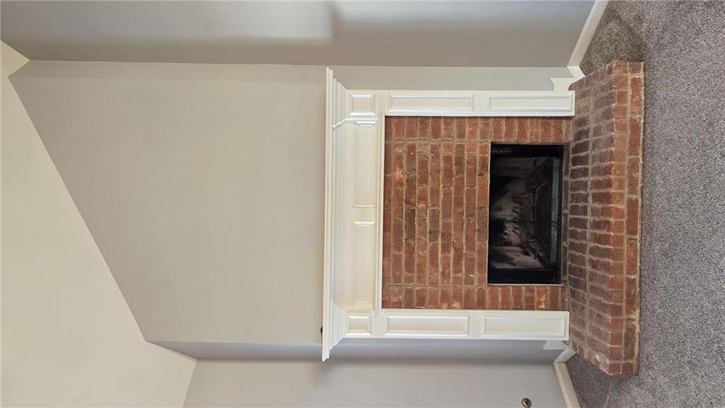 352 Olde Wick Trail Hoschton, GA 30548 - Photo 8 of 34 a living room with a fireplace