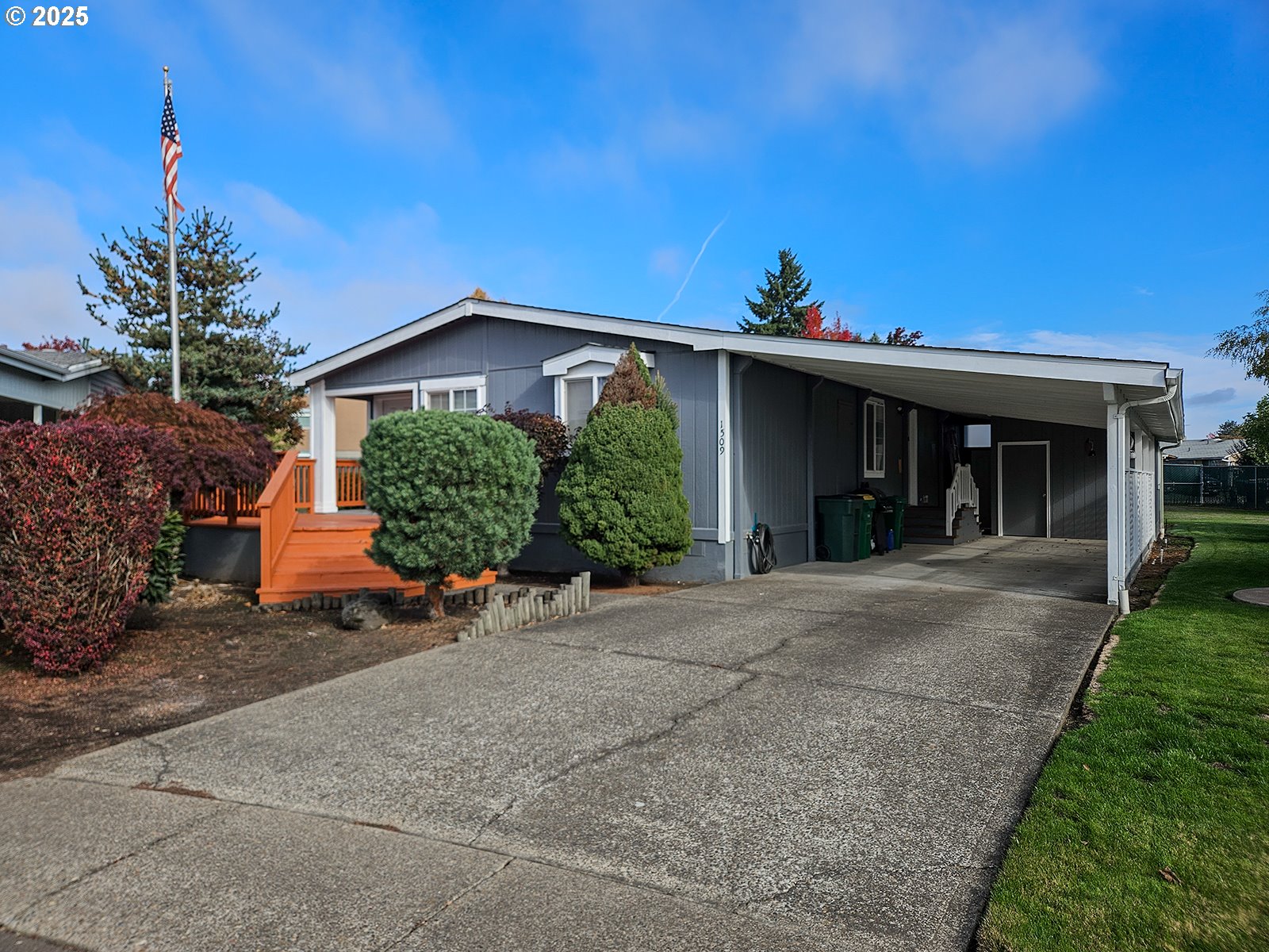 1509 Centennial Circle Forest Grove, OR 97116 - Photo 1 of 45 a front view of a house with a yard and potted plants