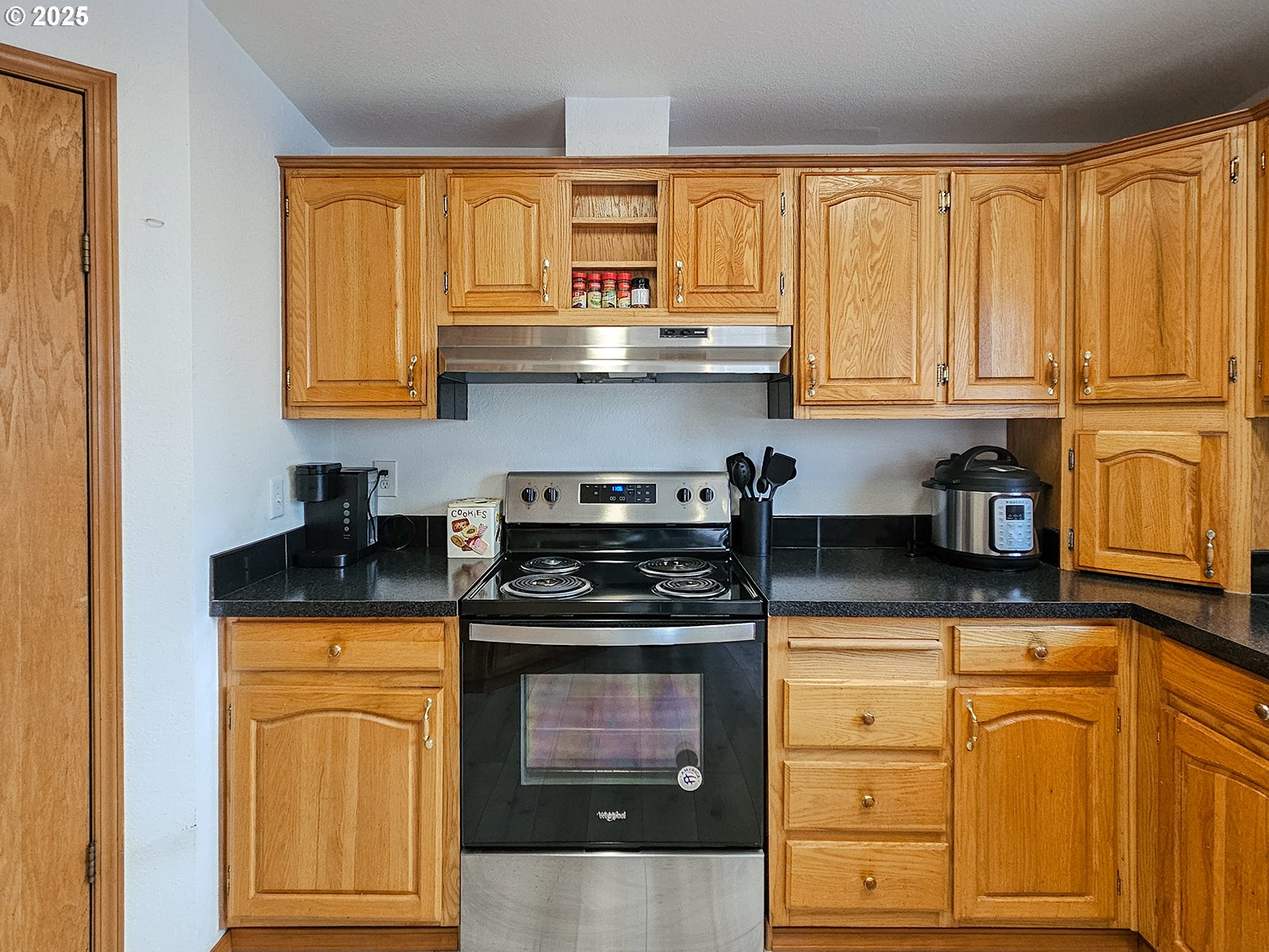 1509 Centennial Circle Forest Grove, OR 97116 - Photo 12 of 45 a kitchen with stainless steel appliances granite countertop a stove a sink and a microwave