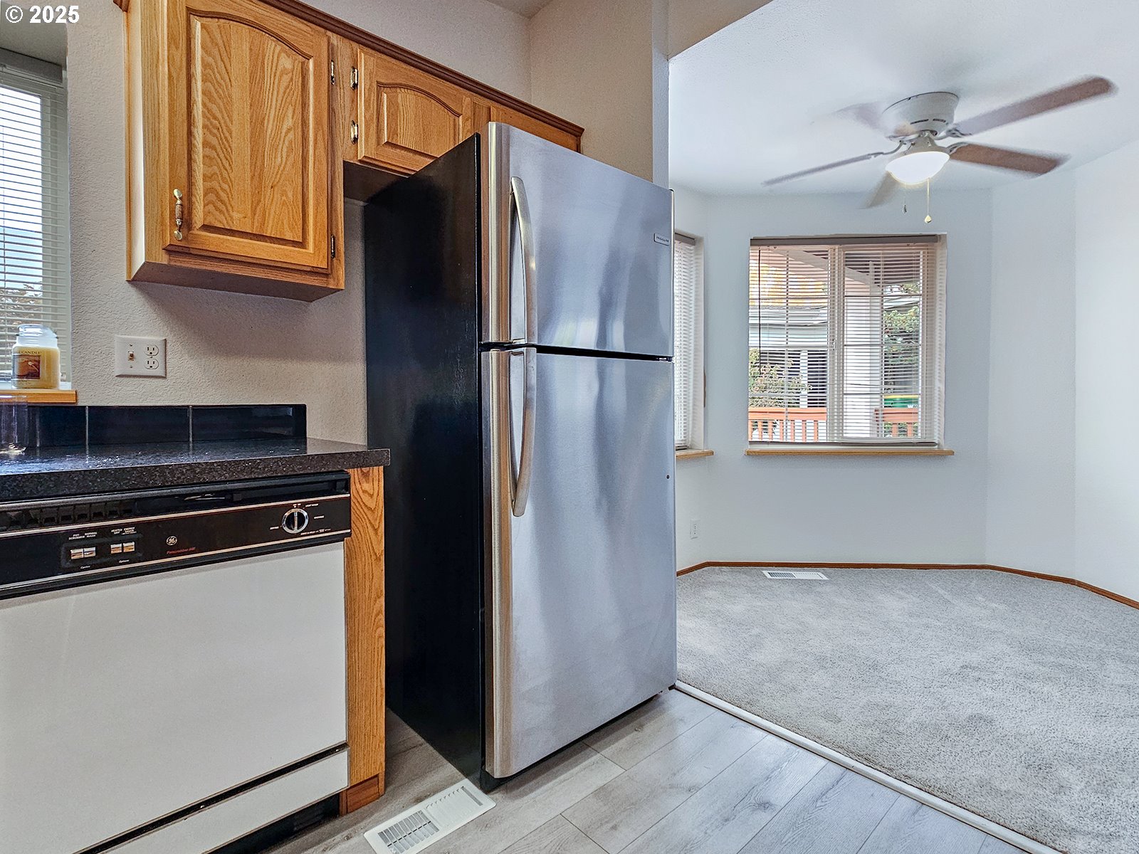 1509 Centennial Circle Forest Grove, OR 97116 - Photo 14 of 45 a kitchen with stainless steel appliances granite countertop a refrigerator stove and microwave
