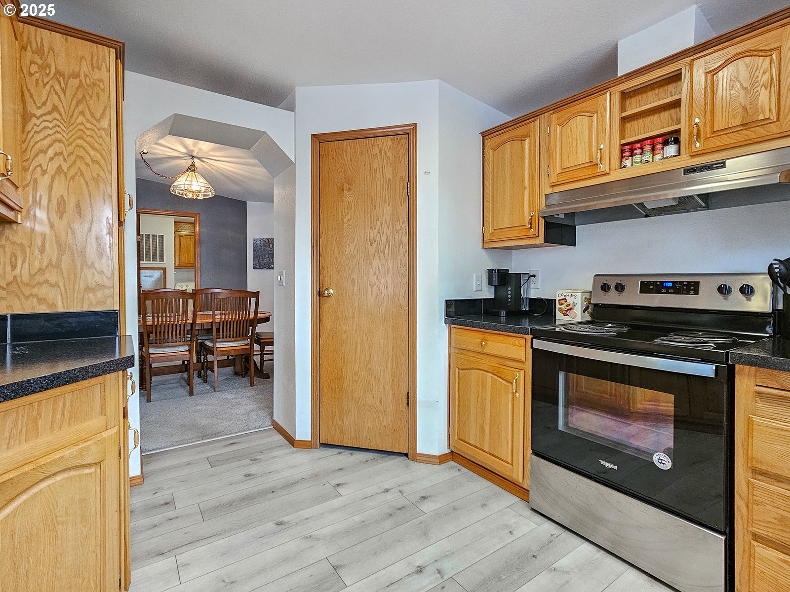 1509 Centennial Circle Forest Grove, OR 97116 - Photo 16 of 45 a kitchen with stainless steel appliances granite countertop a stove and a refrigerator