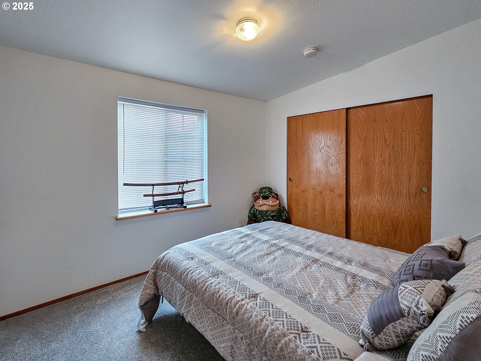 1509 Centennial Circle Forest Grove, OR 97116 - Photo 22 of 45 a bedroom with a bed and a window