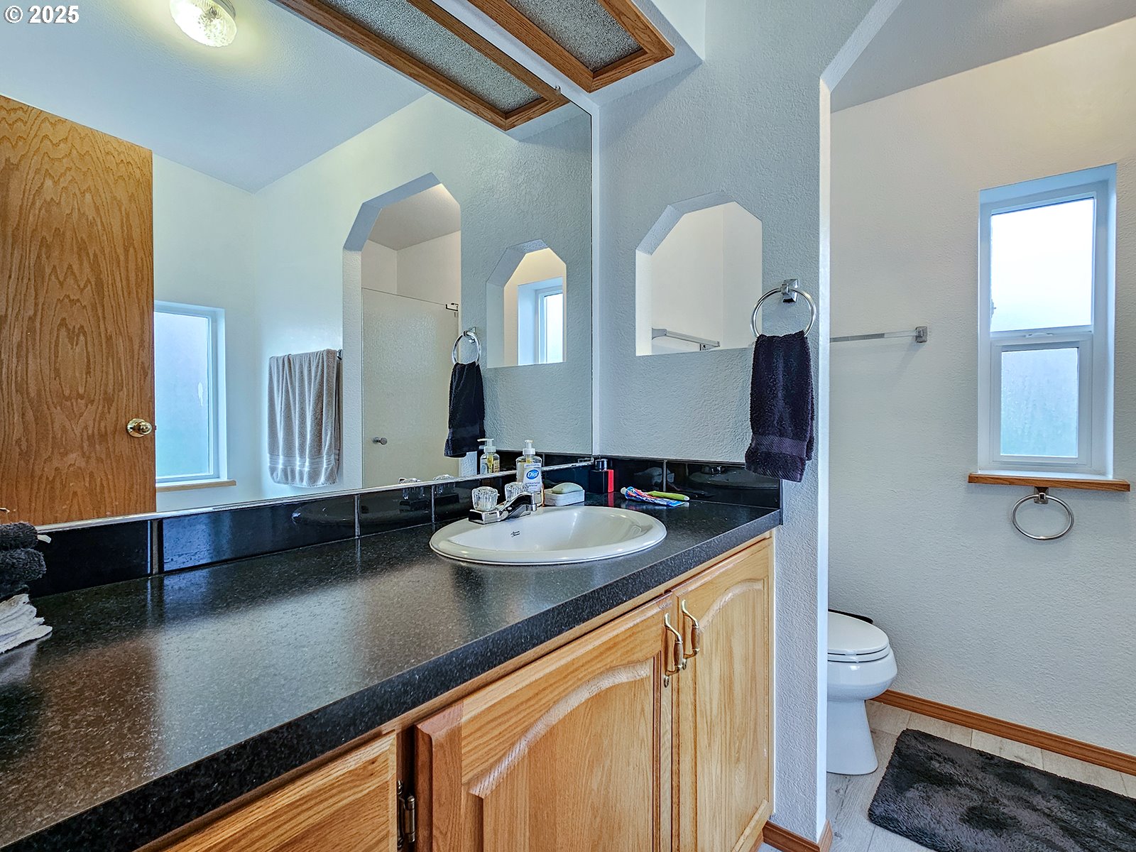 1509 Centennial Circle Forest Grove, OR 97116 - Photo 27 of 45 a bathroom with a sink double vanity and a mirror