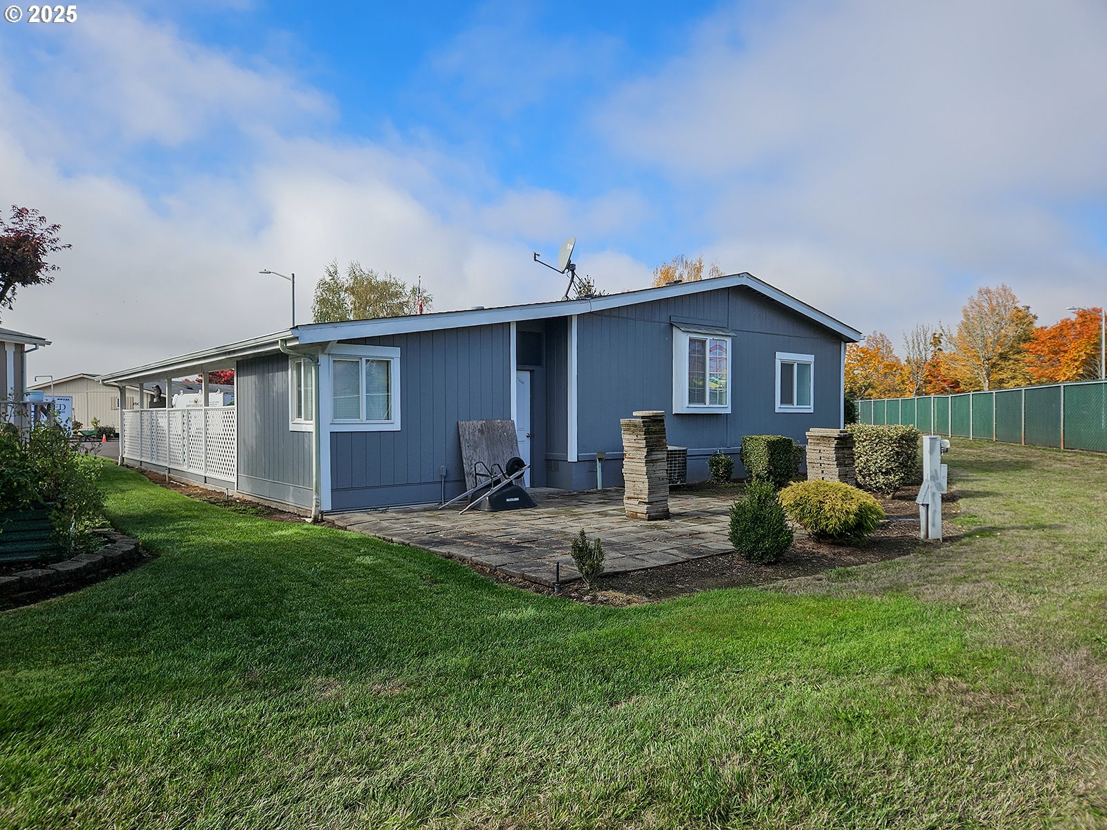 1509 Centennial Circle Forest Grove, OR 97116 - Photo 29 of 45 a view of backyard of house with wooden deck and furniture