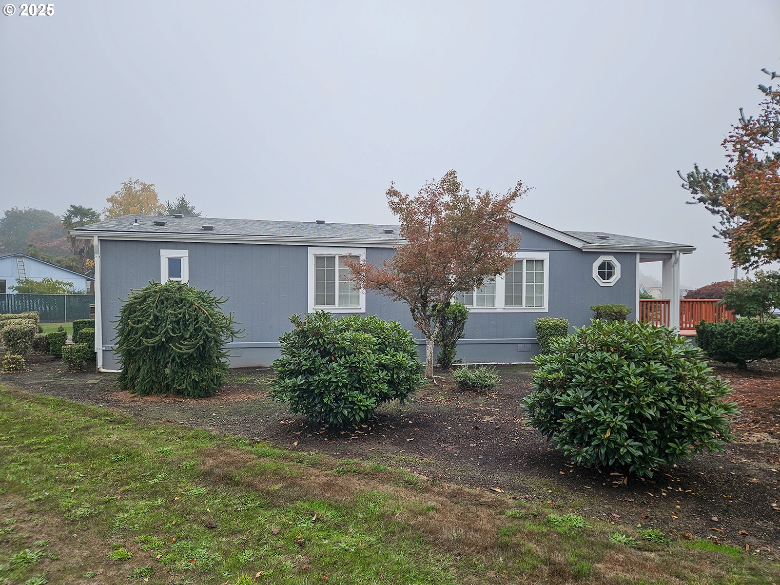 1509 Centennial Circle Forest Grove, OR 97116 - Photo 33 of 45 a front view of a house with garden