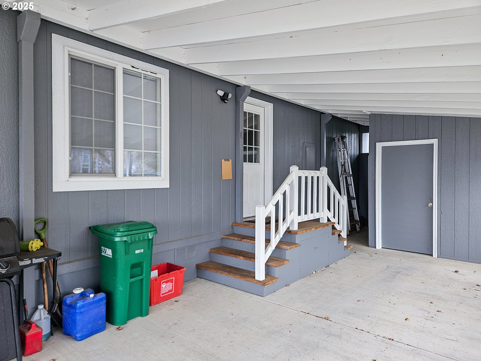 1509 Centennial Circle Forest Grove, OR 97116 - Photo 4 of 45 a view of an empty room with stairs and a couch