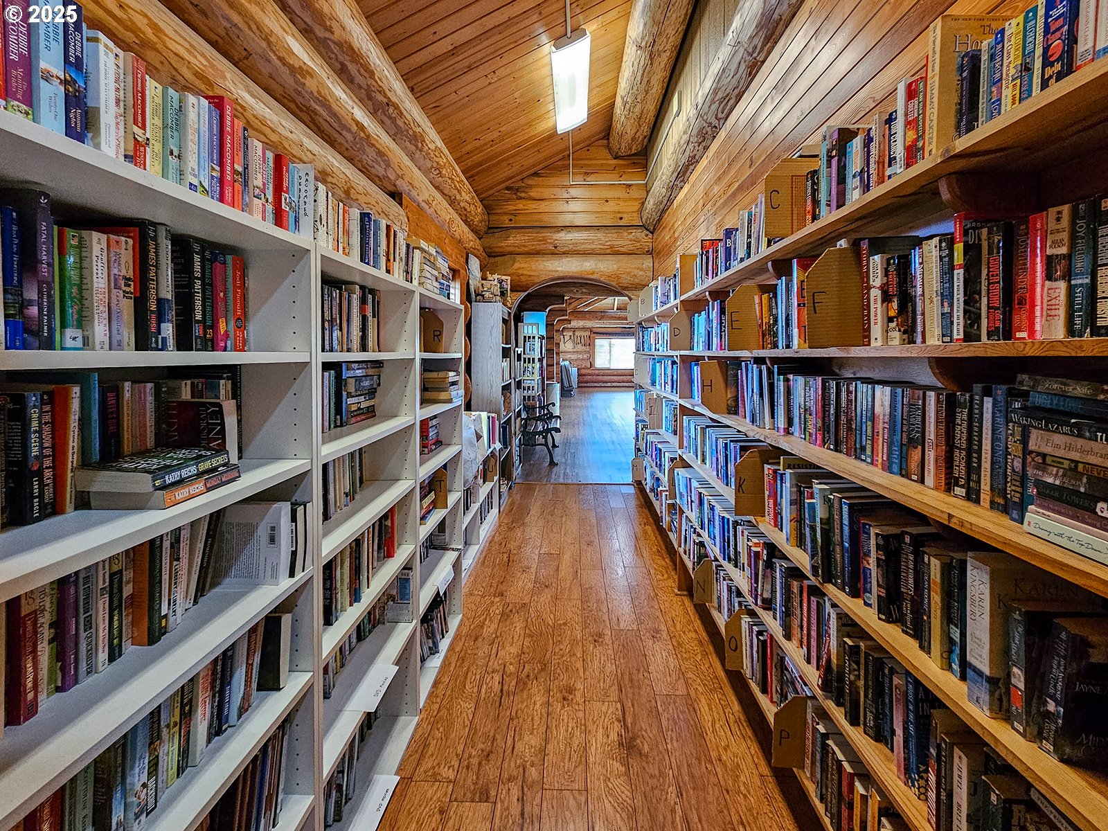 1509 Centennial Circle Forest Grove, OR 97116 - Photo 42 of 45 a hallway with a book shelf and a book shelf