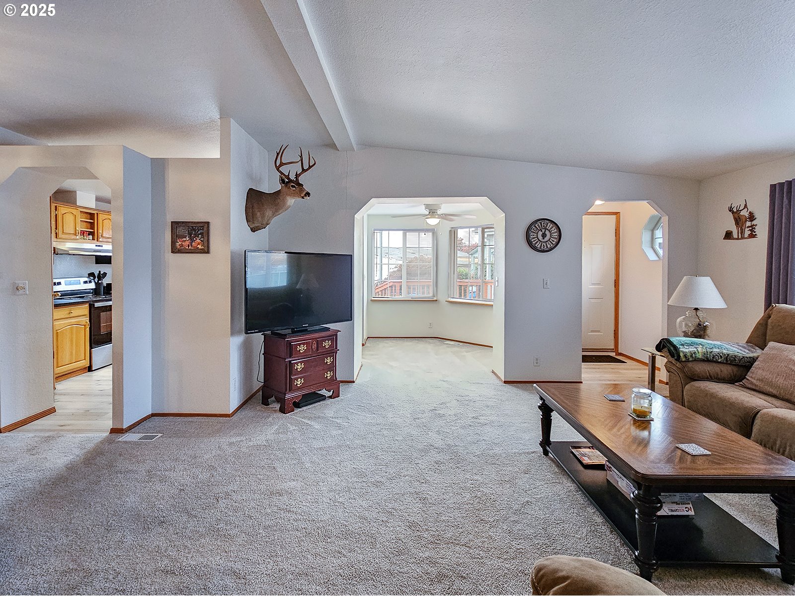1509 Centennial Circle Forest Grove, OR 97116 - Photo 6 of 45 a living room with furniture and a flat screen tv
