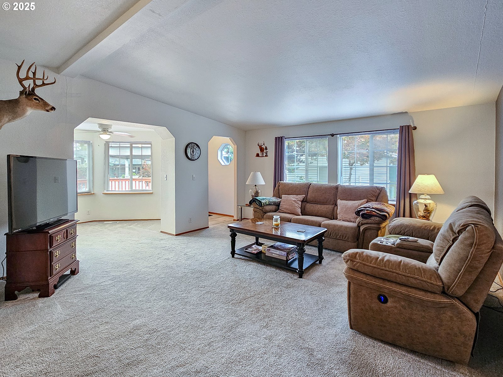 1509 Centennial Circle Forest Grove, OR 97116 - Photo 7 of 45 a living room with furniture and a flat screen tv
