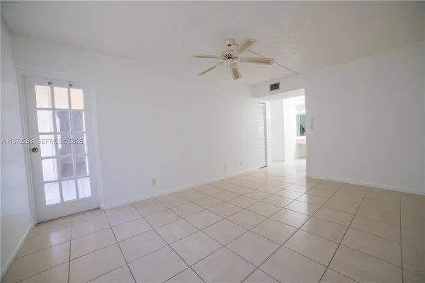 a view of an empty room and window