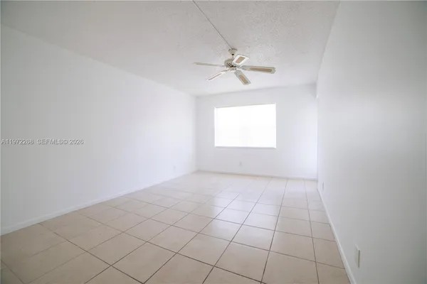a view of an empty room with a window