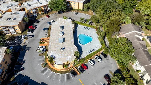 an aerial view of a swimming pool and outdoor space