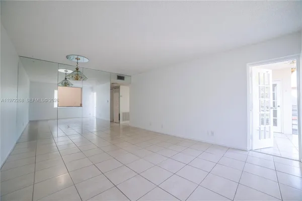 a view of a kitchen with a sink and a window