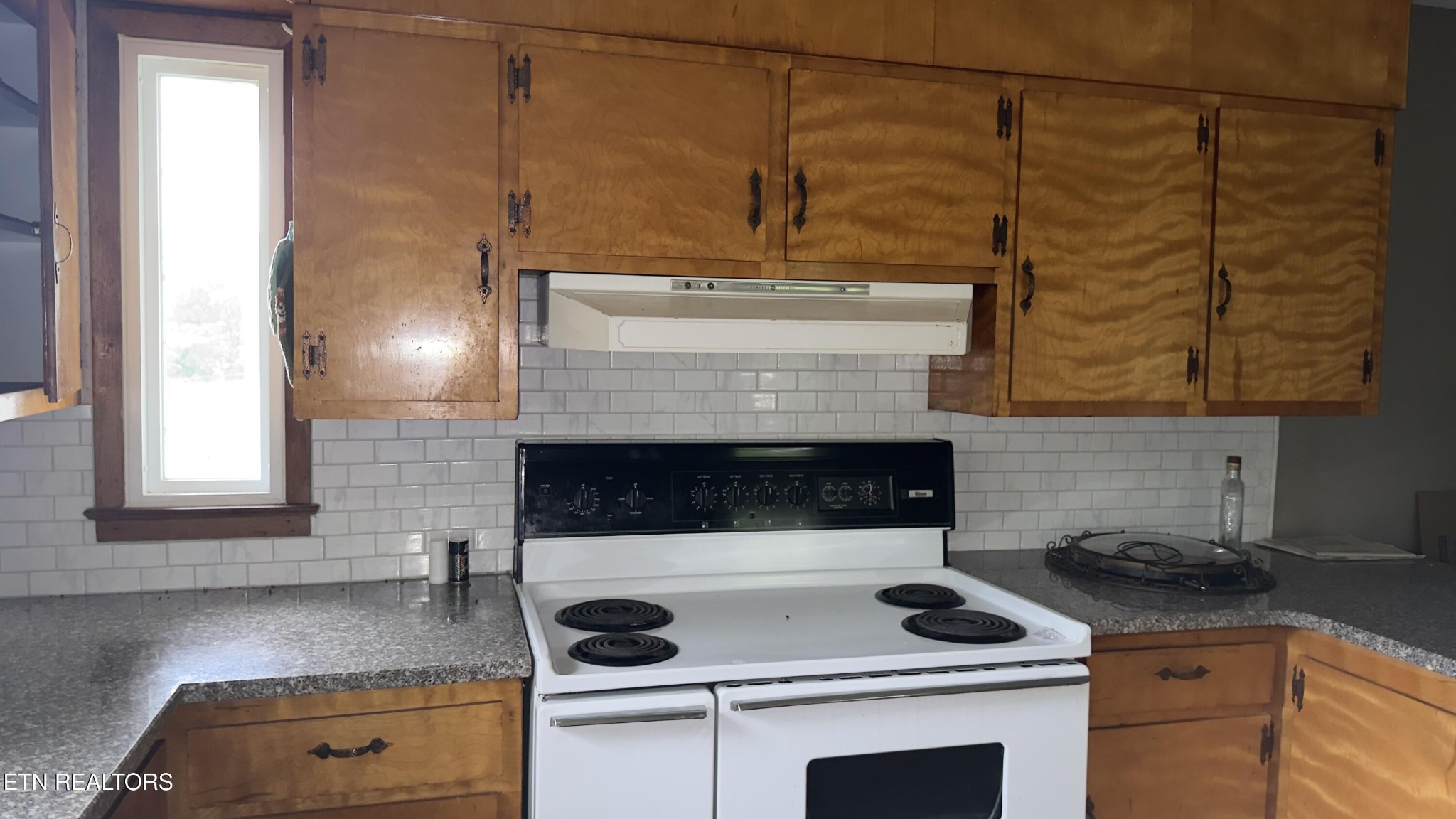 2662 Louisville Road Maryville, TN 37801 - Photo 11 of 60 a kitchen with a stove and cabinets