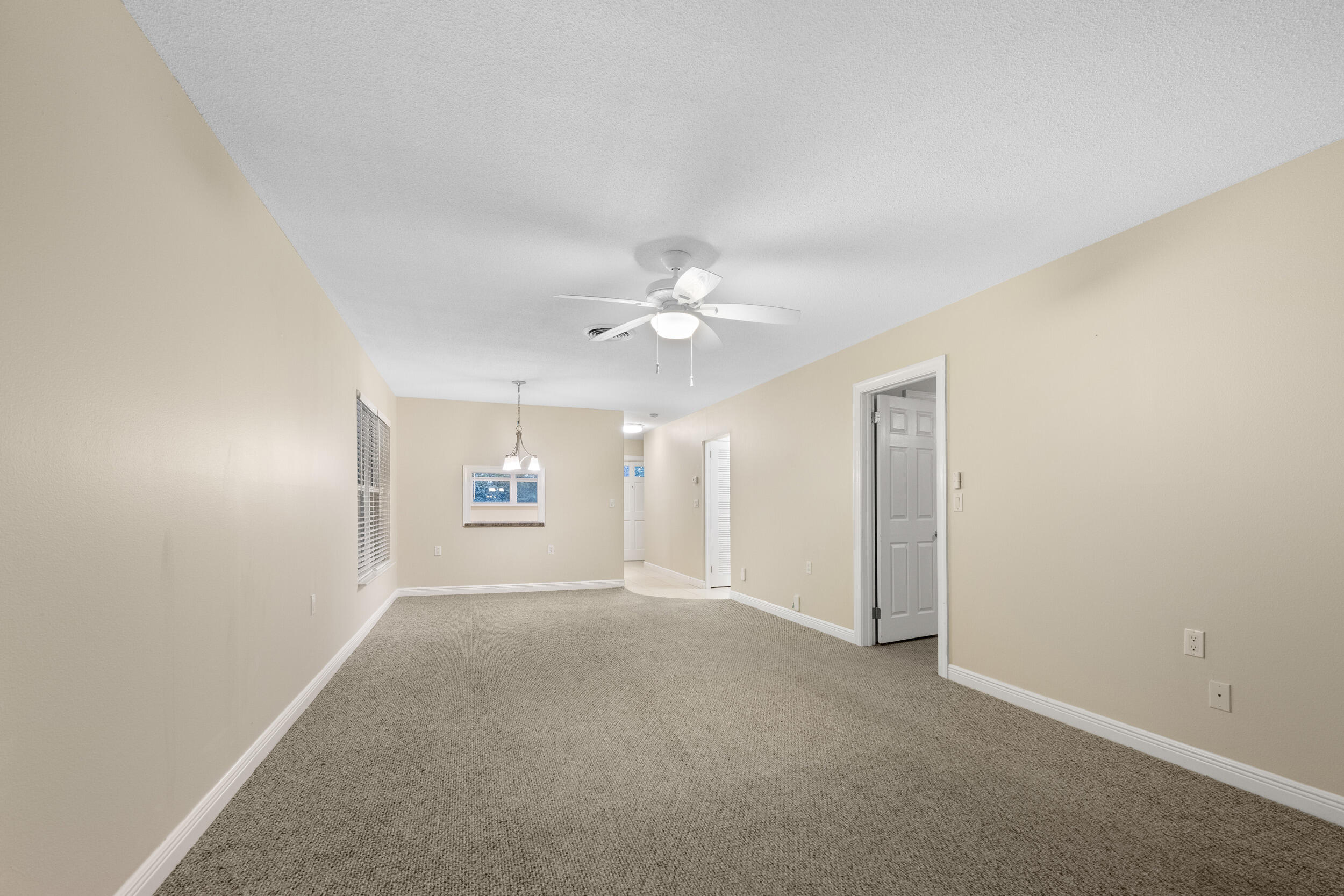 1900 South Kanner Highway, Unit 4204 Stuart, FL 34994 - Photo 13 of 26 an empty room with ceiling fan and window