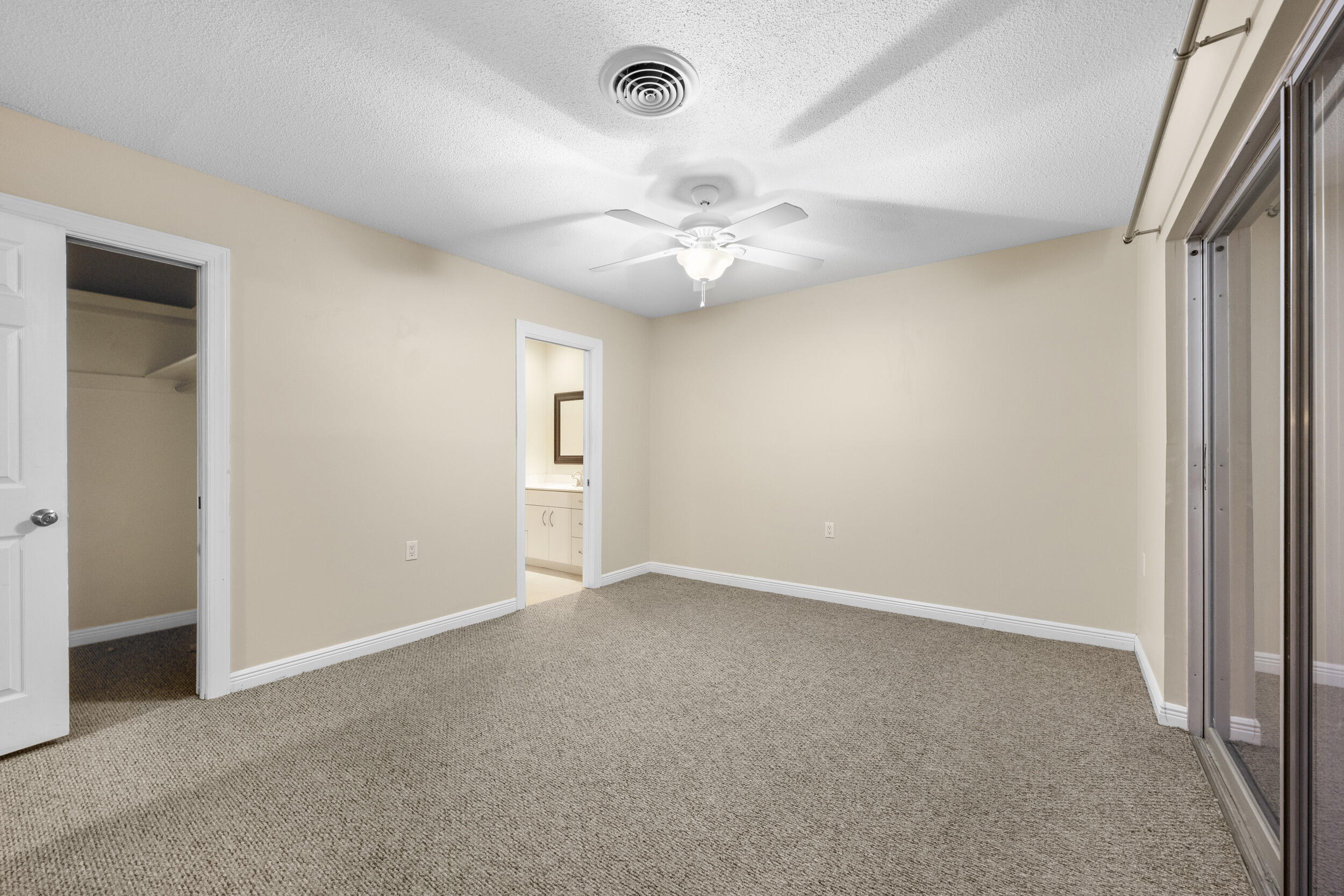 1900 South Kanner Highway, Unit 4204 Stuart, FL 34994 - Photo 15 of 26 an empty room with windows and fan