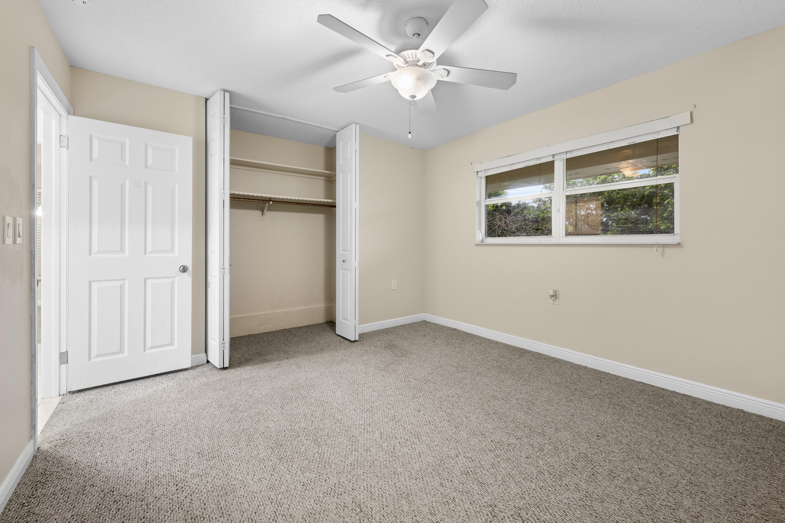 1900 South Kanner Highway, Unit 4204 Stuart, FL 34994 - Photo 22 of 26 an empty room with windows and fan