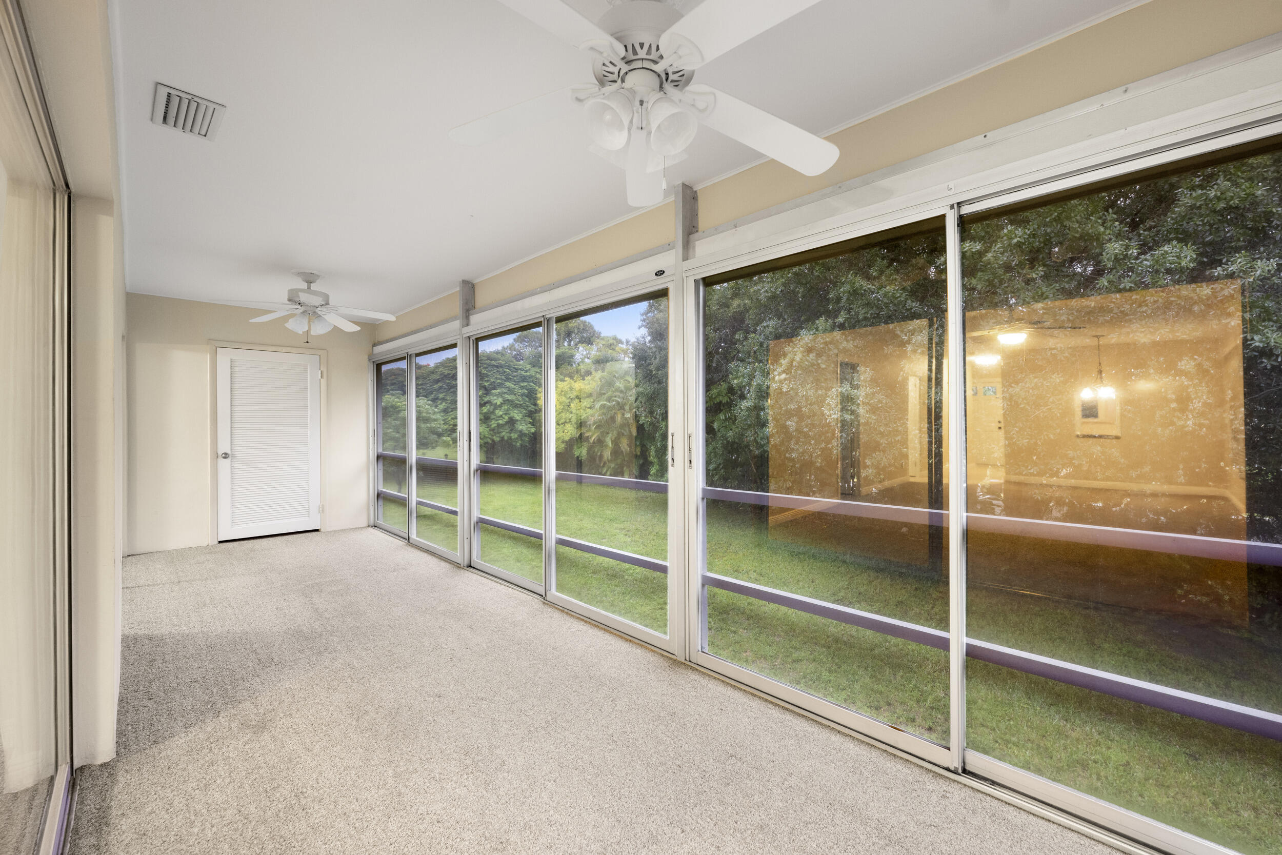 1900 South Kanner Highway, Unit 4204 Stuart, FL 34994 - Photo 24 of 26 a view of an empty room with a sliding door