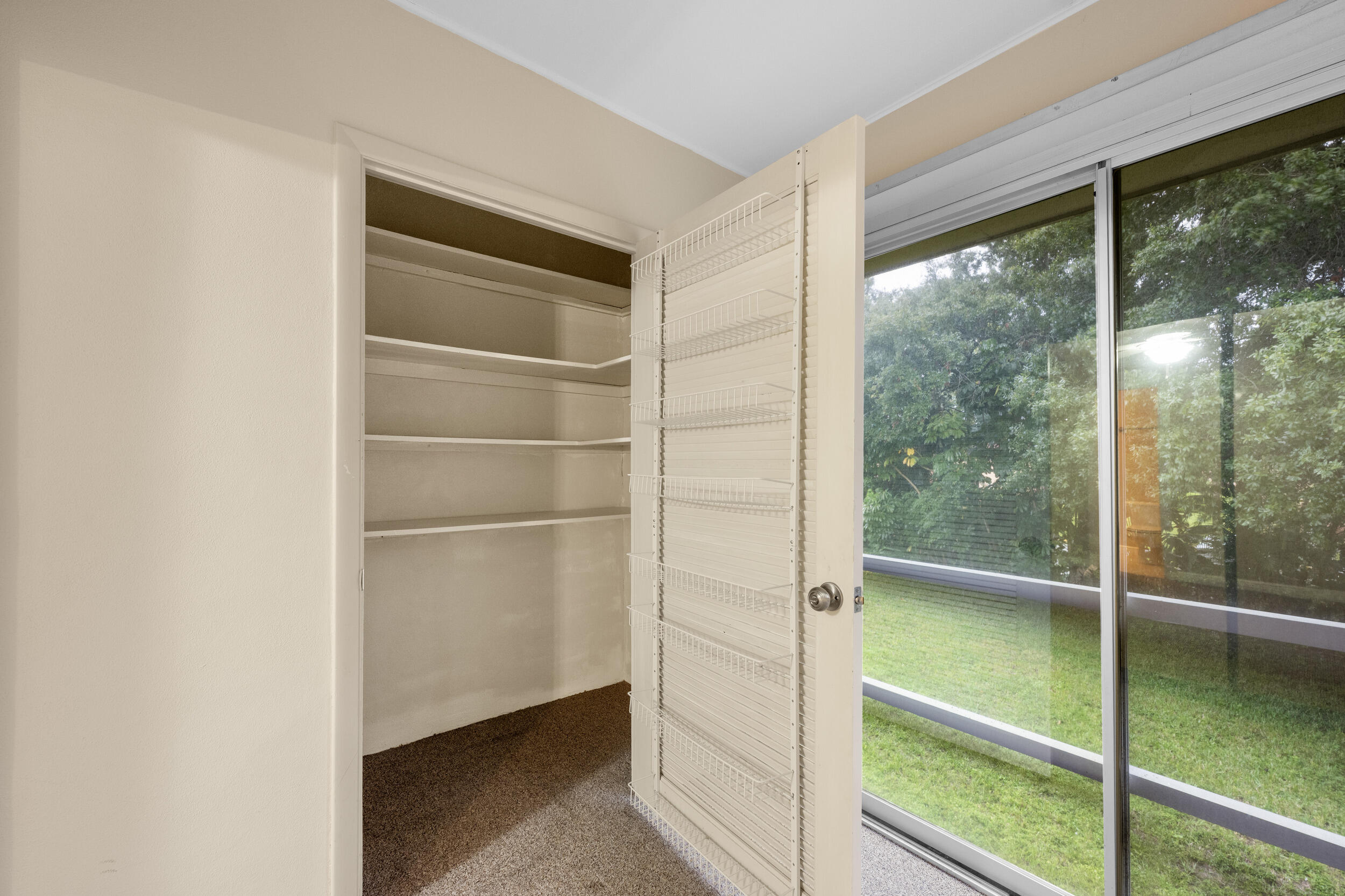 1900 South Kanner Highway, Unit 4204 Stuart, FL 34994 - Photo 26 of 26 a room with walk in closet and a window