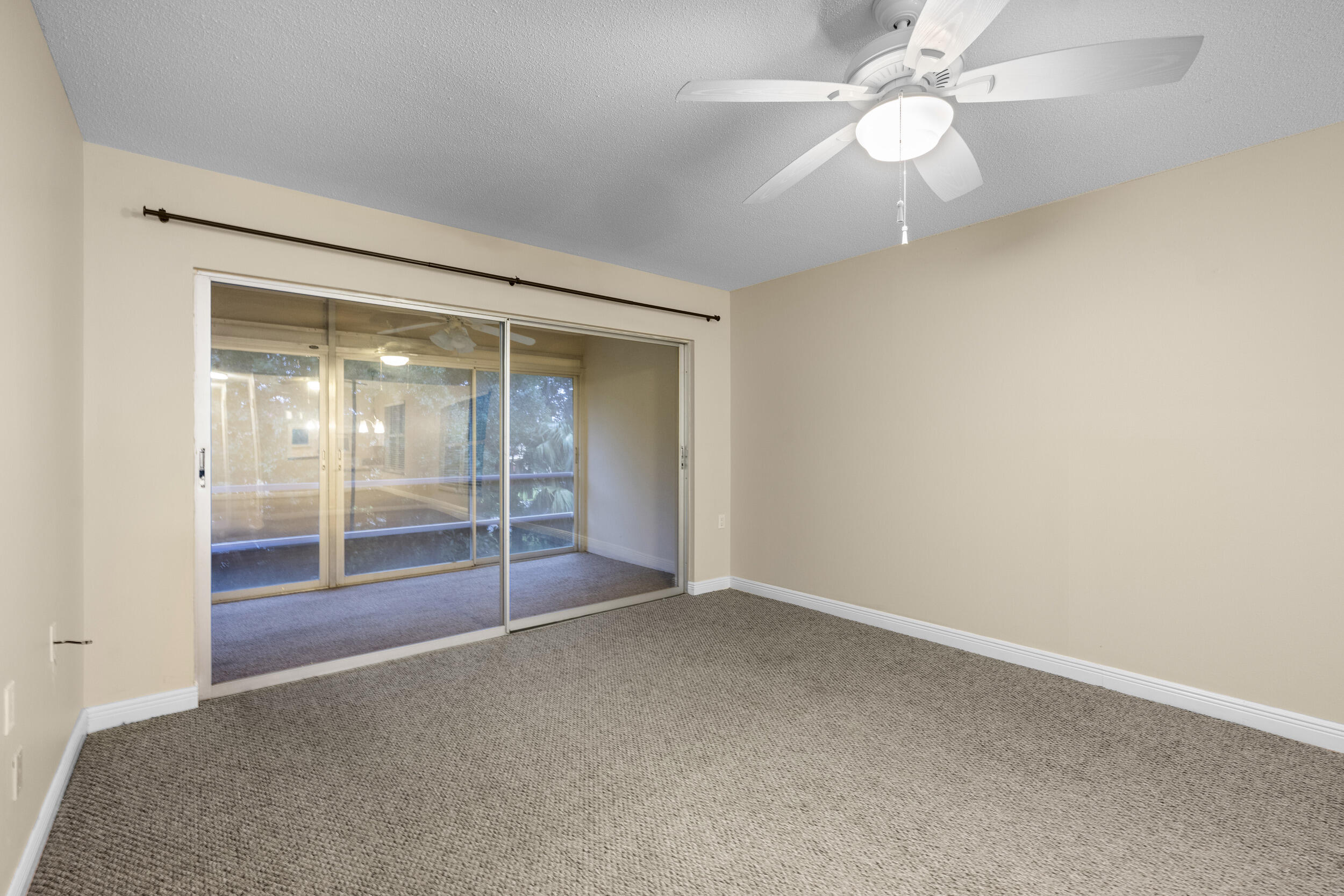 1900 South Kanner Highway, Unit 4204 Stuart, FL 34994 - Photo 10 of 26 an empty room with chandelier fan
