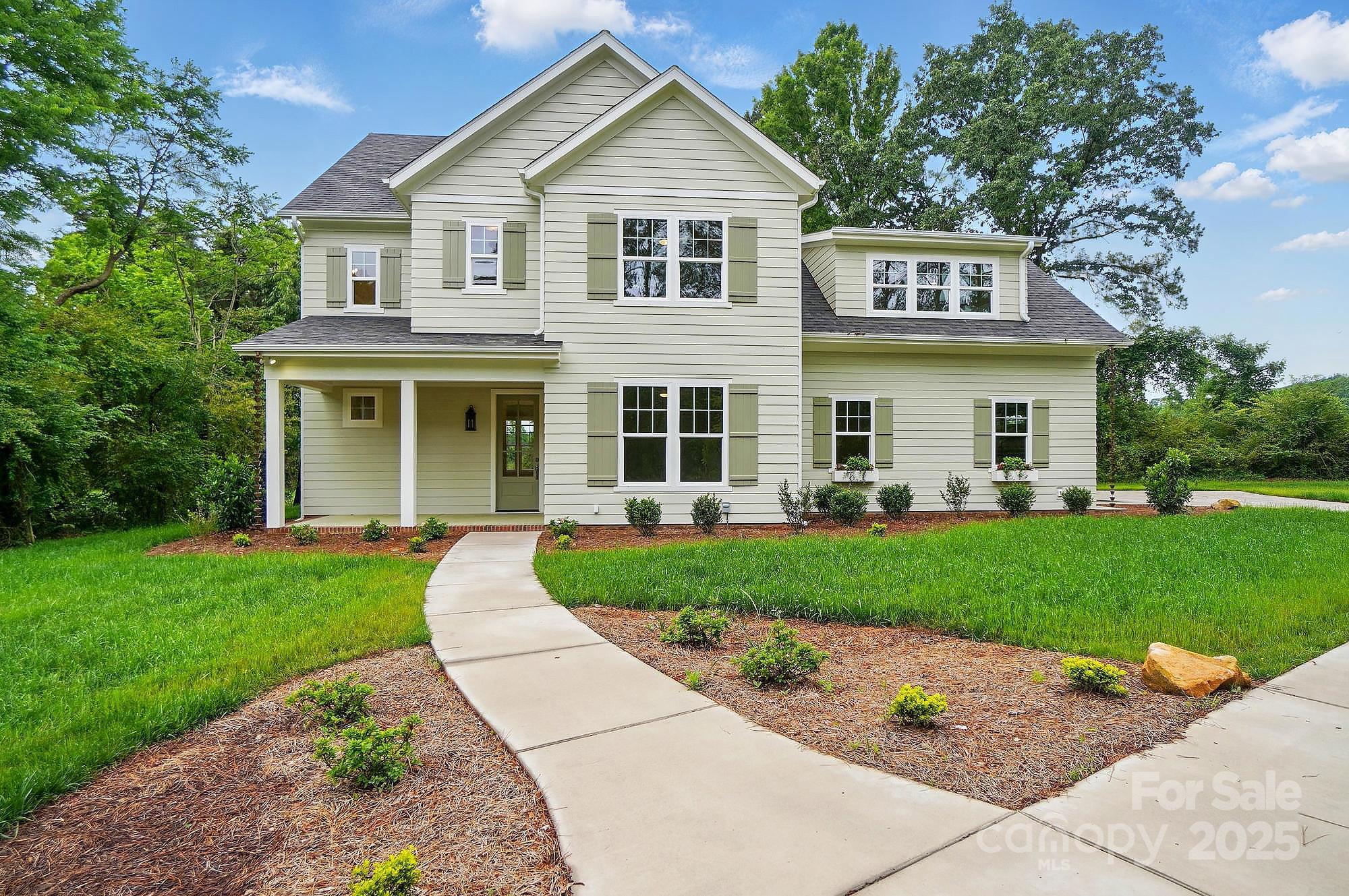 9315 Simpson Road Waxhaw, NC 28173 - Photo 2 of 45 a front view of a house with a yard