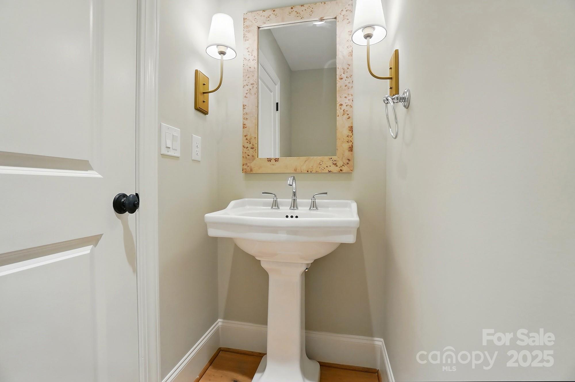 9315 Simpson Road Waxhaw, NC 28173 - Photo 22 of 45 a bathroom with a sink a mirror and shower