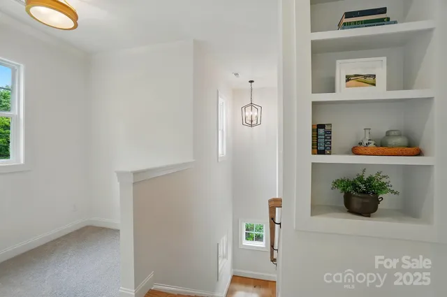 a kitchen with stainless steel appliances granite countertop a refrigerator and a stove