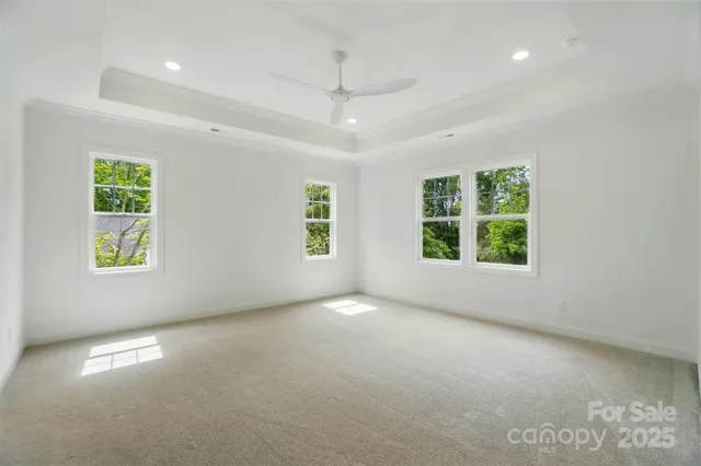 an empty room with windows and entrance