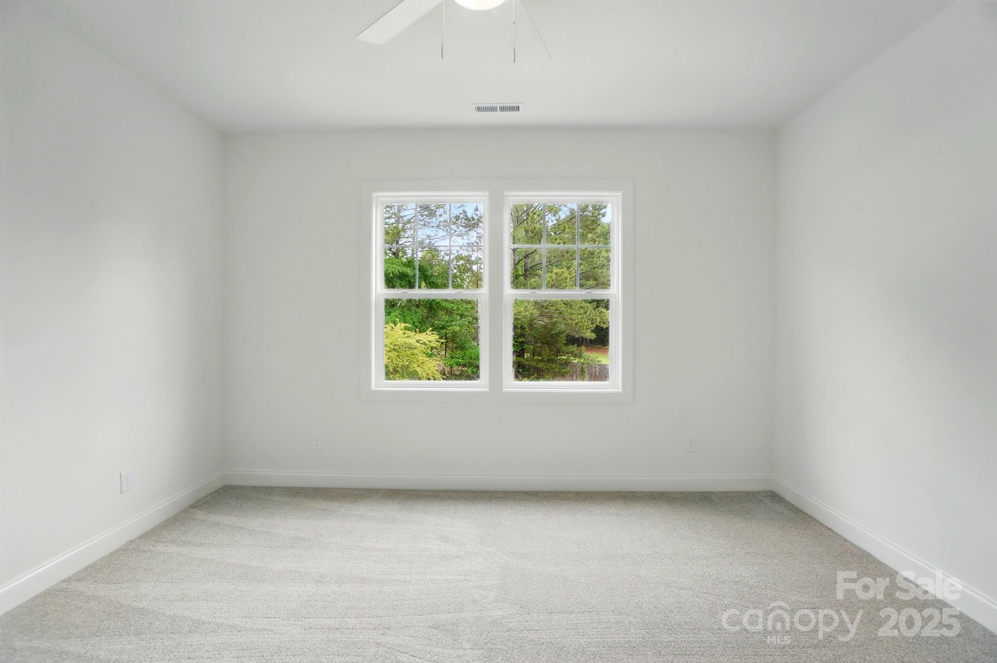 9315 Simpson Road Waxhaw, NC 28173 - Photo 34 of 45 an empty room with a window