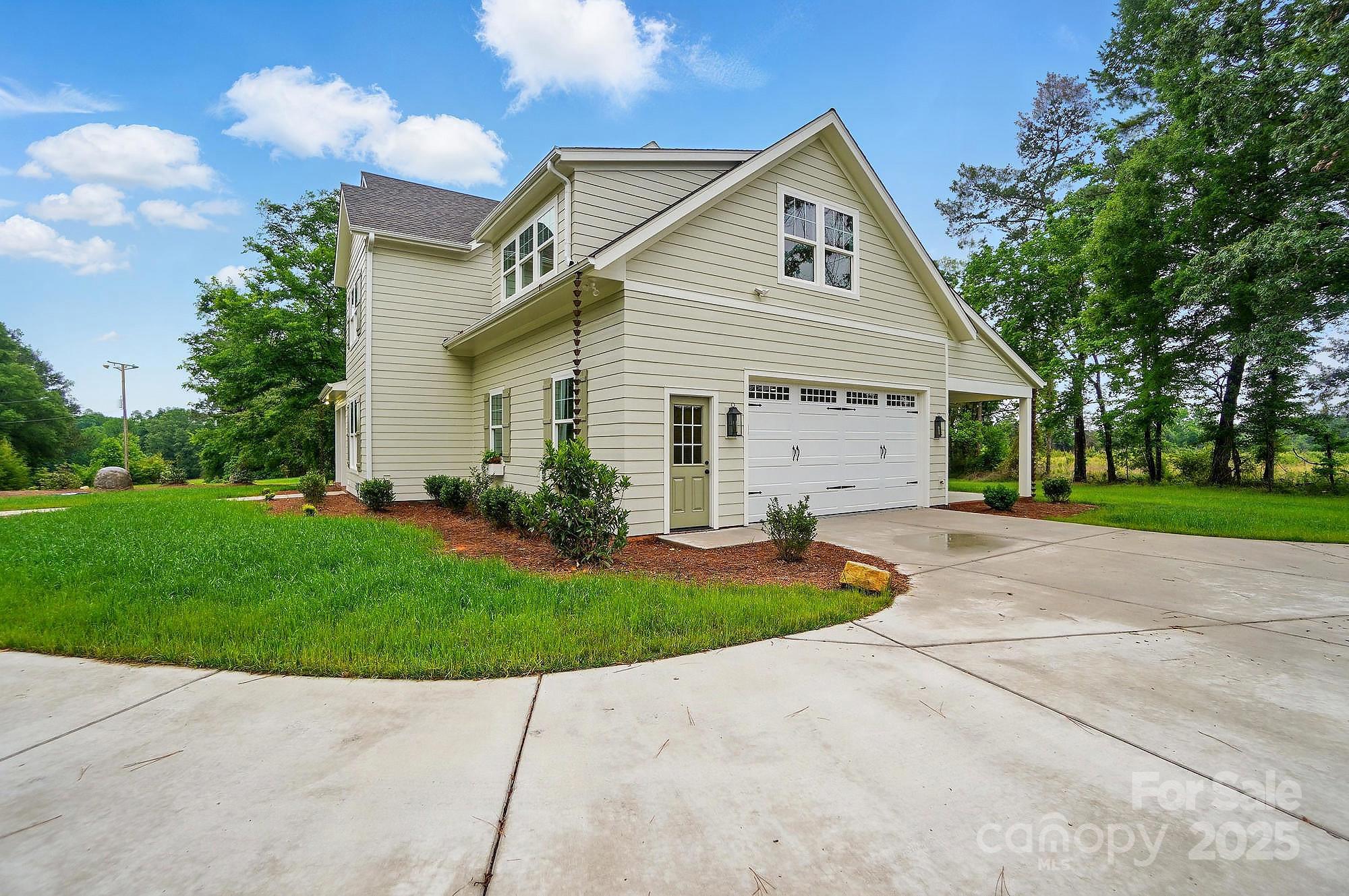 9315 Simpson Road Waxhaw, NC 28173 - Photo 41 of 45 a view of a house with a yard