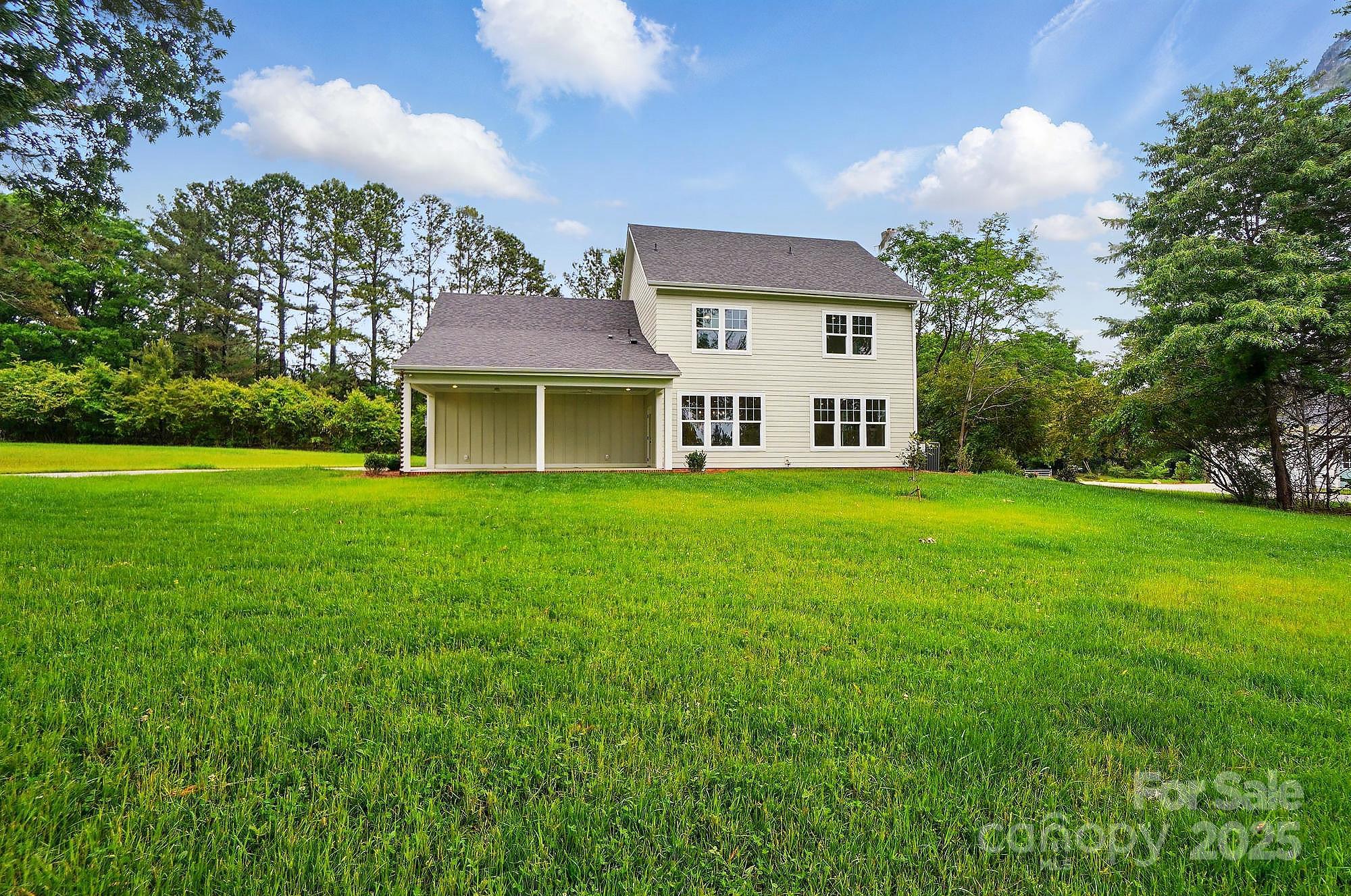 9315 Simpson Road Waxhaw, NC 28173 - Photo 45 of 45 a house view with a garden space