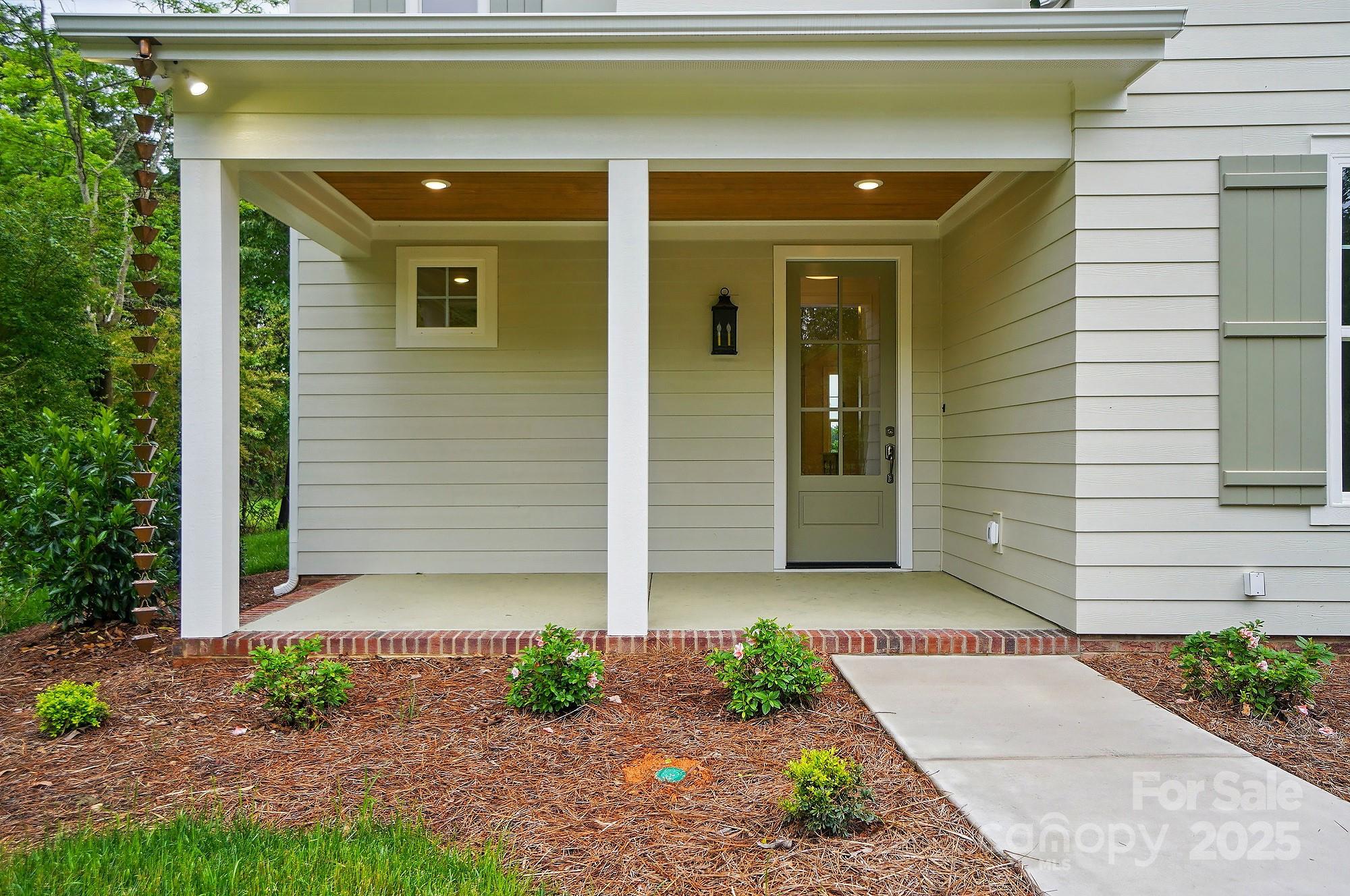 9315 Simpson Road Waxhaw, NC 28173 - Photo 5 of 45 a front view of a house with garden