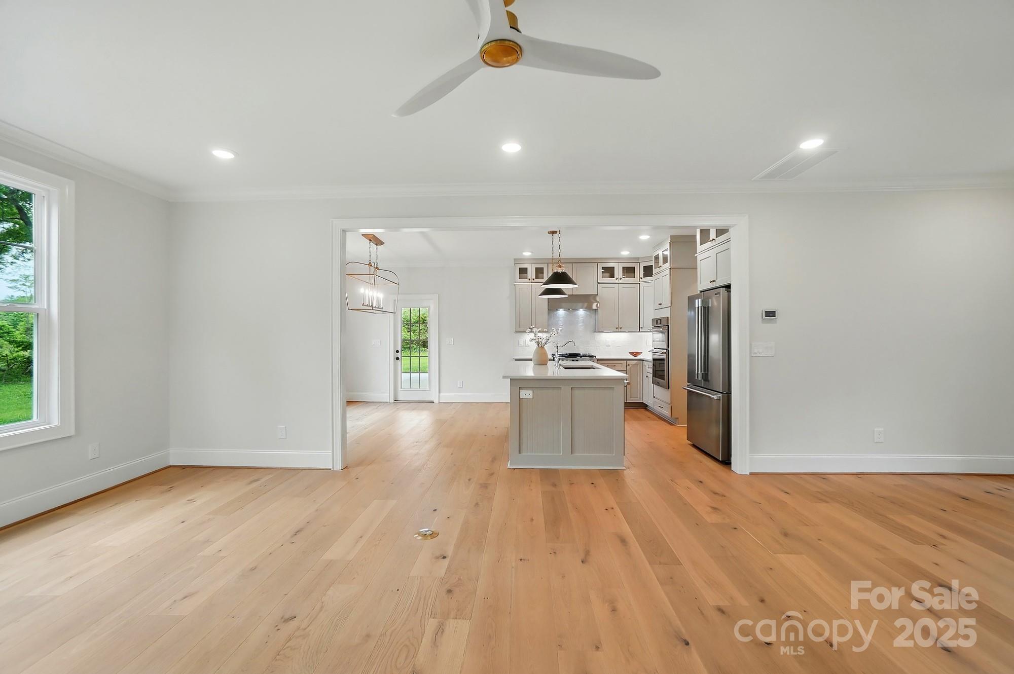 9315 Simpson Road Waxhaw, NC 28173 - Photo 10 of 45 a view of a kitchen with wooden floor