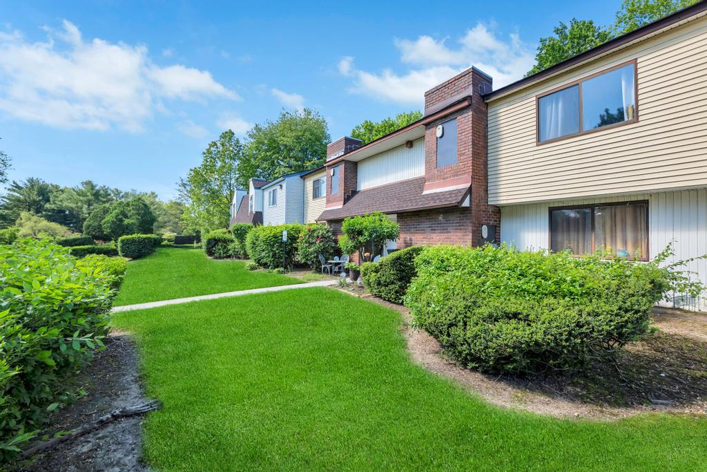 237 Pointe Circle North, Unit 237 Coram, NY 11727 - Photo 1 of 1 a front view of a house with a yard