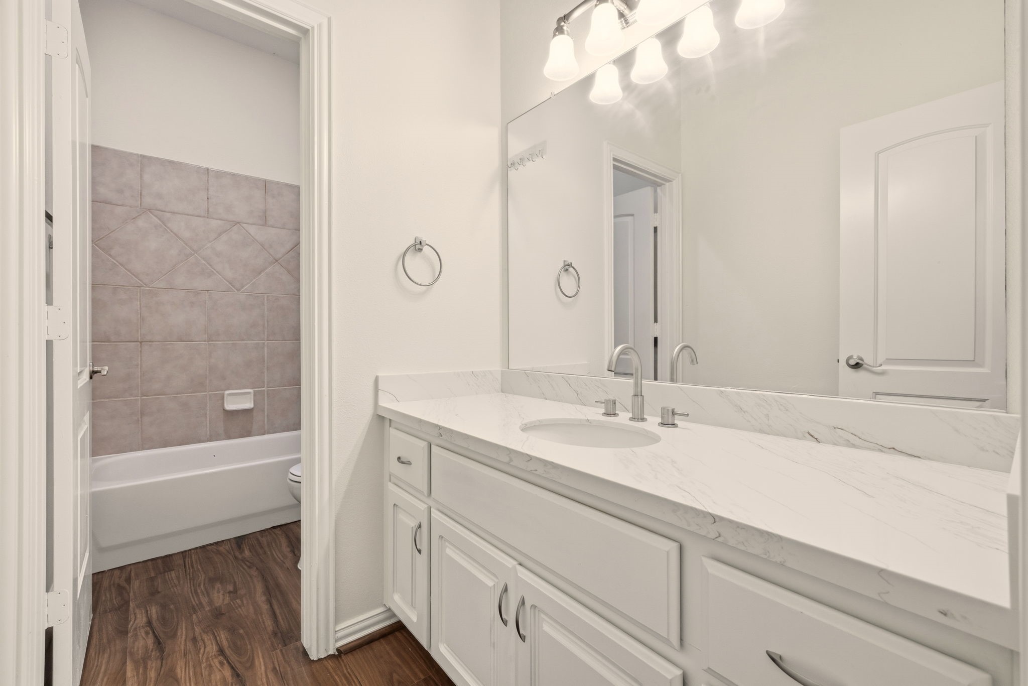 25207 Oak Star Drive Spring, TX 77389 - Photo 11 of 18 a bathroom with a sink a toilet and shower