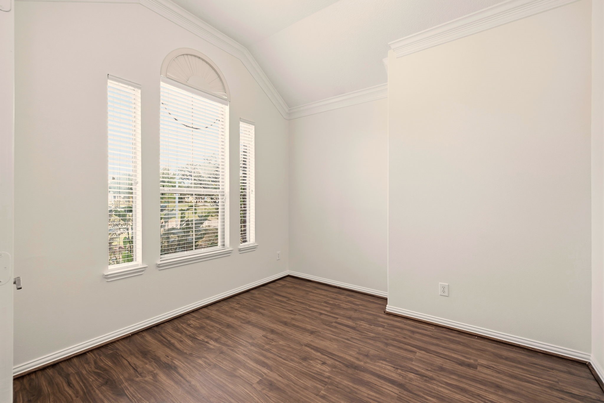 25207 Oak Star Drive Spring, TX 77389 - Photo 13 of 18 an empty room with wooden floor and windows
