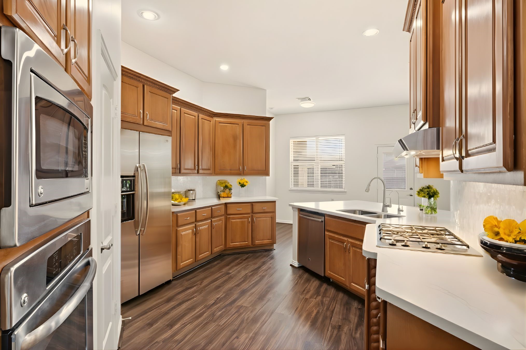25207 Oak Star Drive Spring, TX 77389 - Photo 3 of 18 a kitchen with a sink stove top oven and refrigerator