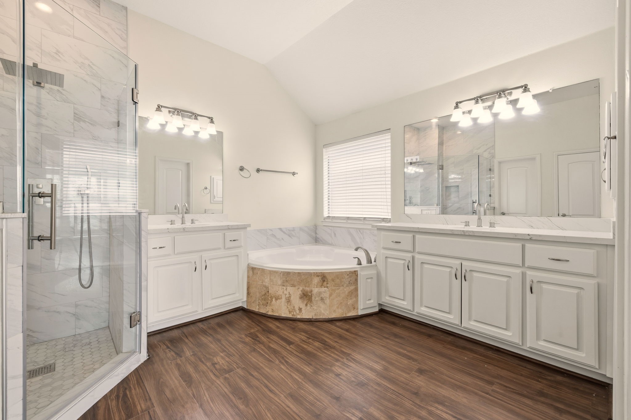 25207 Oak Star Drive Spring, TX 77389 - Photo 10 of 18 a bathroom with a double vanity sink a mirror and a shower
