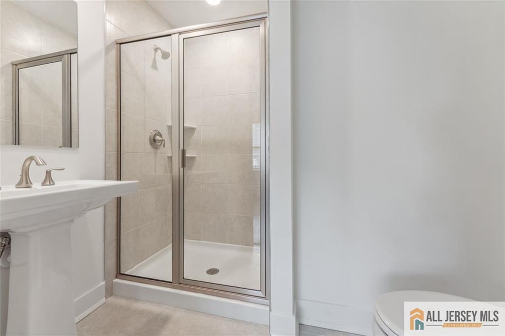 46 Mariveles Way Eatontown, NJ 07724 - Photo 12 of 26 a bathroom with a shower and a sink