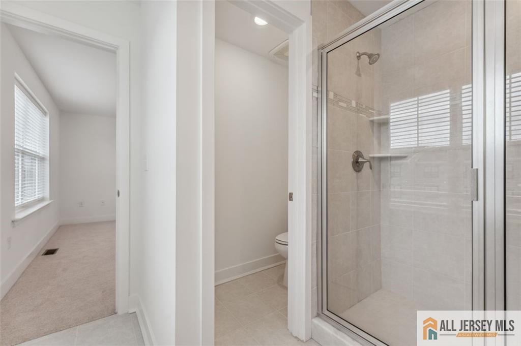 46 Mariveles Way Eatontown, NJ 07724 - Photo 14 of 26 a bathroom with a shower and a sink