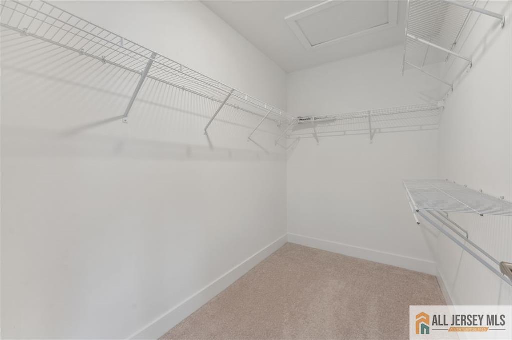 46 Mariveles Way Eatontown, NJ 07724 - Photo 15 of 26 a view of a room with racks on the wall