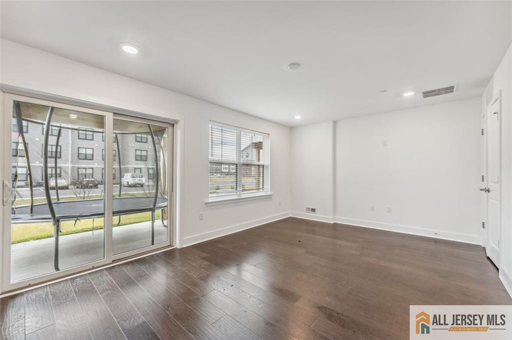 46 Mariveles Way Eatontown, NJ 07724 - Photo 19 of 26 wooden floor in an empty room with a window