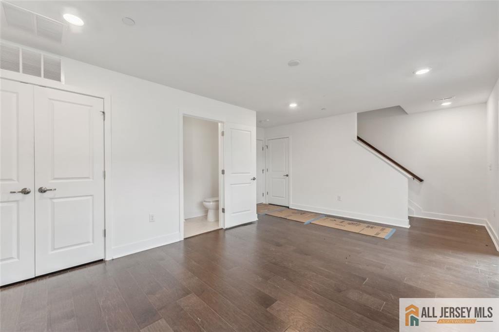 46 Mariveles Way Eatontown, NJ 07724 - Photo 20 of 26 an empty room with wooden floor and windows