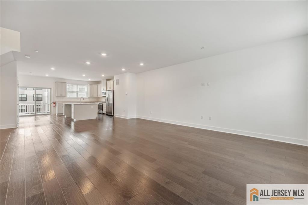 46 Mariveles Way Eatontown, NJ 07724 - Photo 2 of 26 a view of kitchen and hall with wooden floor