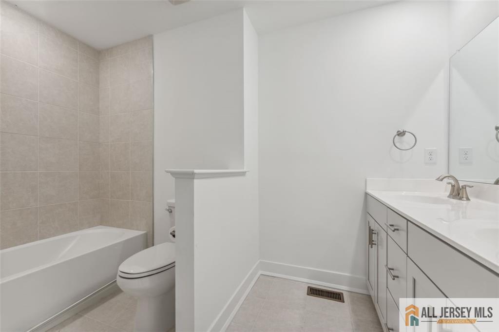 46 Mariveles Way Eatontown, NJ 07724 - Photo 21 of 26 a bathroom with a granite countertop sink toilet and shower