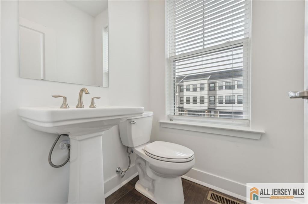 46 Mariveles Way Eatontown, NJ 07724 - Photo 22 of 26 a bathroom with a sink a toilet and a window